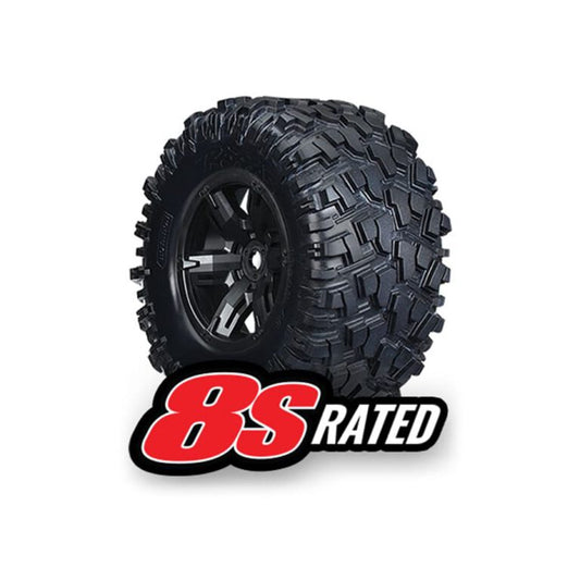 إطارات وعجلات Traxxas، مجمعة وملصقة (عجلات X-Maxx® سوداء، إطارات Maxx® AT، حشوات إسفنجية) (يسار ويمين) (2)